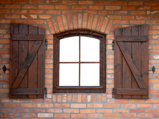 Wall Mural - Small brown window on the brick building wall, brown wooden shutters. Glass isolated on white