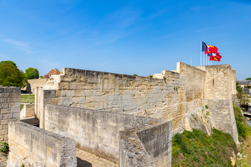 Wall Mural - Caen medieval castle  walls and flags in Normandy, France