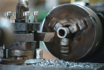 Lathe machine close up abstract background.