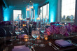 © SuperStock - Low angle wide empty shot of table setting at a formal party at dusk.