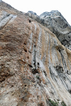 High Imposing Steep Limestone Wall Overhanging Rock Without Peop