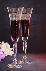 high-stemmed crystal wine glasses with red wine