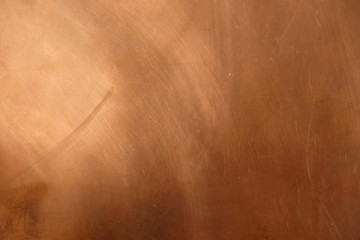 Copper surface in daylight. Copper background with scratches. Copy space. Minimalism.