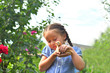 © Natasha  - happy little smiling girl holding her hen outside the countryside house in a sunny summer day. Concept: love for animals and nature.Happy childrens day.sisters day
