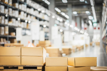 Stack of cardboard boxes in smart warehouse industry logistic.