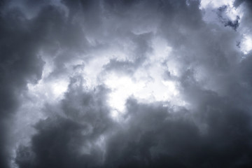 Wall Mural - terrible thunderclouds from the side of a plane. gloomy epic clouds. background image in a dark gray