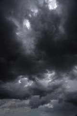 Wall Mural - terrible thunderclouds from the side of a plane. gloomy epic clouds. background image in a dark gray