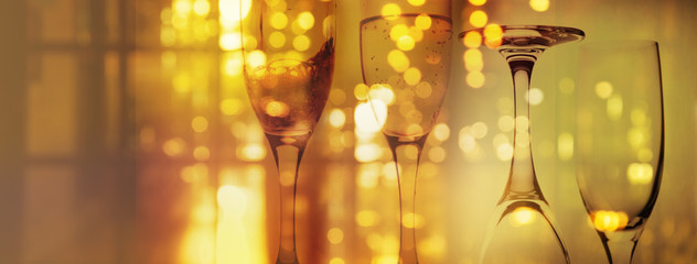 alcohol drinking glass for party or celebration in bar or pub gold blur bokeh food service web banner background