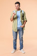 © Pixel-Shot - Portrait of male student with mobile phone on color background