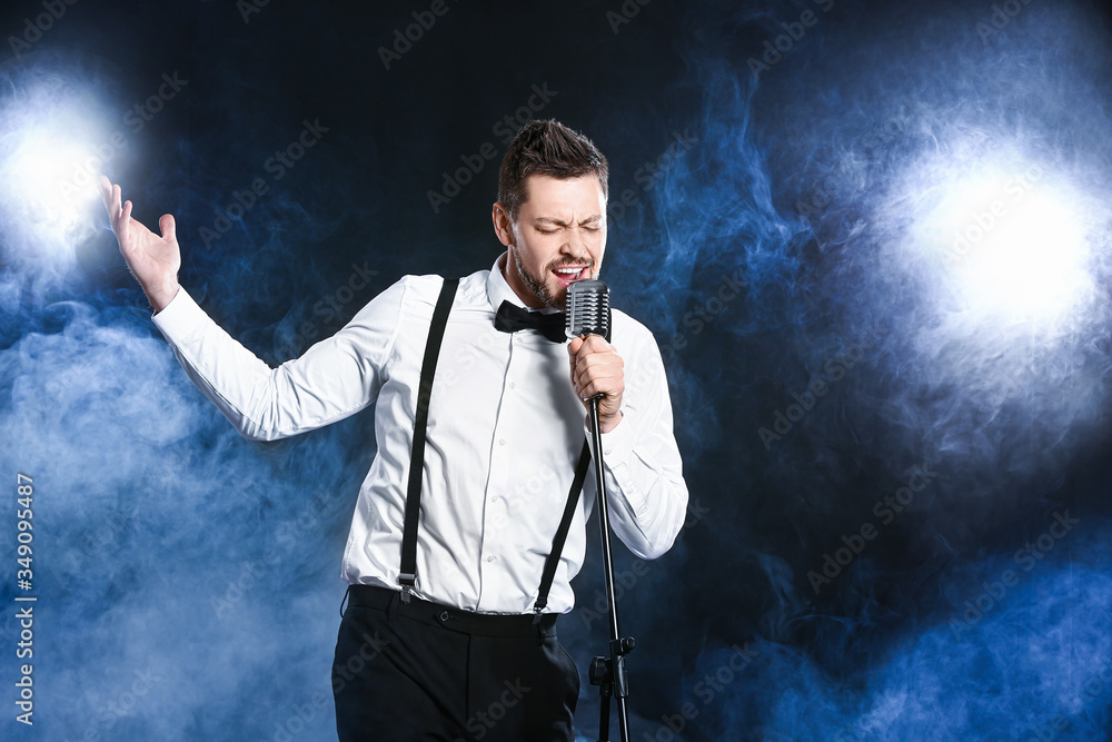 Handsome man singing on stage