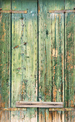 Aged green wood pattern of a door in Burano, Italy.