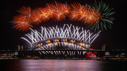 NYE 2020 fireworks view from the western side of the Sydney Harbour Bridge. Blues Point Reserve, Sydney, NSW, Australia. 