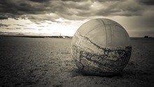 Close-up Of A Soccer Ball On Landscape