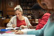 © Rido - Happy students studying at library