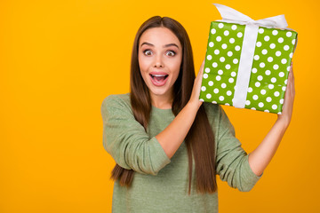 Sticker - Portrait astonished crazy girl enjoy rejoice big green white ribbon gift box she get 14-february 8-march celebration impressed scream wow omg wear jumper isolated bright color background