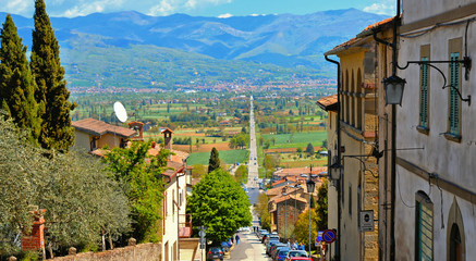 Wall Mural - ANGHIARI, ITALY. long straight ancient roman road in Tiber valley that connects Anghiari and San Sepolcro with mountains in background. Arezzo Tuscany, Italy