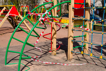 Closed children's playground. COVID-19 security and protection measures in the city par