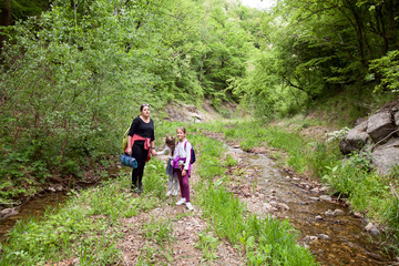 Wall Mural - Family Enjoy Nature, Hiking, People, Stream,Spring