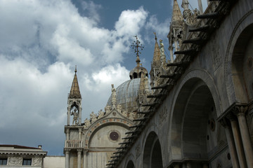 Wall Mural - Marble facade of St. Mark's Cathedral with mosaics, sculptures in Venice in sunny summer day.