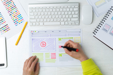 Wall Mural - web site developer creates a sketch of the interface on the desktop. the designer draws the project 