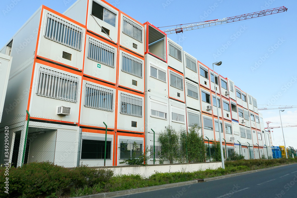 Prefabricated modular offices. Stacking of boxes for construction site ...