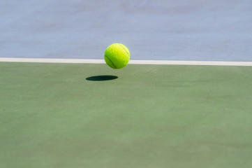 Wall Mural - Close-Up Of A Shadow And A Tennis Ball. Individual sport