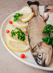 Wall Mural - Fresh trout fish with lemon parsley cranberries