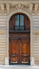 Wall Mural - Paris, an old wooden door, typical building in the Marais
