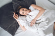 © Алина Троева - Attractive smiling young woman stretching in bed waking up alone happy concept, awake after healthy sleep in cozy comfortable bed and mattress enjoy good morning