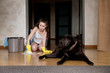 © Вячеслав Думчев - The dog sadly watches her mistress washing the floor after the dog s toilet