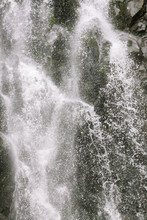 A Large Waterfall Over Some Water