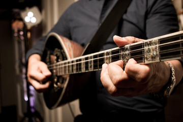 Guitar player on a party. Greek music band.