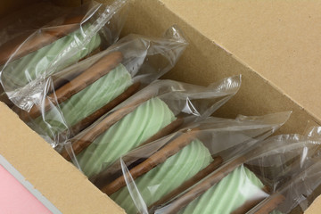 Poster - Mint ice cream sandwiches individually wrapped in plastic in box