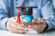 Learning and education teacher holding playdough world, graduation hat creative thinking improving learning studying skills college university school graduation of employment business profession jobs