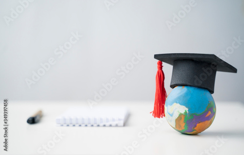 Learning and education play dough world and graduation hat copy space with note and pen creative thinking improving learning studying skills, college university school graduation of employment jobs