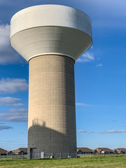 Concrete potable water supply tower in urban city setting