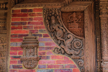 Wall Mural - Carvings of various gods in one of the temple of Patan Durbar Square, Patan, Nepal