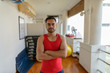 © Ranta Images - Young handsome bearded Indian man with arms crossed ready for gym