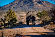 View Of The American West With A Saddle And A Wagon