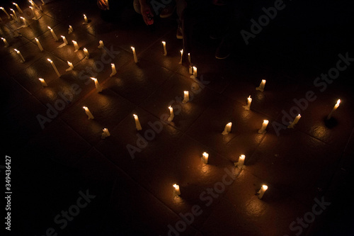 Fotografía High Angle View Of Candles Arranged In Darkroom