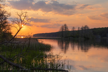 Wall Mural - charming landscape on the river at sunset and night time