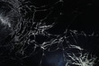 Leinwandbild Motiv Crack on the glass. Broken screen. Broken phone. Cracked glass background. White cracks in the glass.