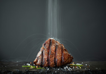 Poster - the salt is poured onto freshly grilled steak