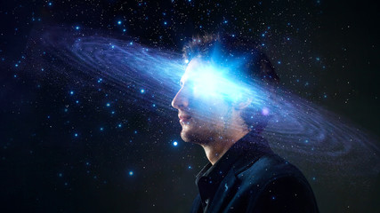Wall Mural - dreamer, creative mind concept. a man with a galaxy in his head,