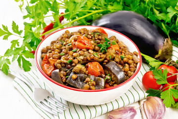 Wall Mural - Lentils with eggplant in bowl on napkin