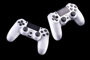 Poster - Set of white video game joysticks gamepad isolated on a black background