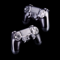 Poster - Set of black video game joysticks gamepad isolated on a black background