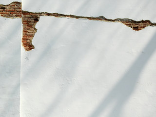 Poster - crack on white wall with shadow impact from earthquake