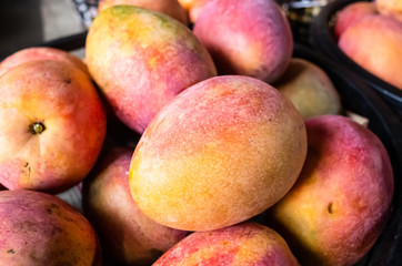 Canvas Print - mango fruits in a basket at traditional marketplace