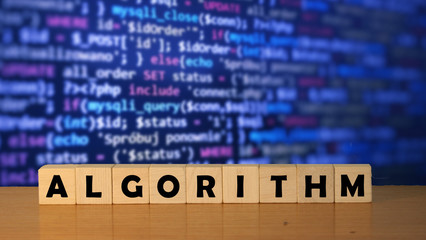 algorithm message word on a wooden desk on cube blocks with a blue code software developer backgroun